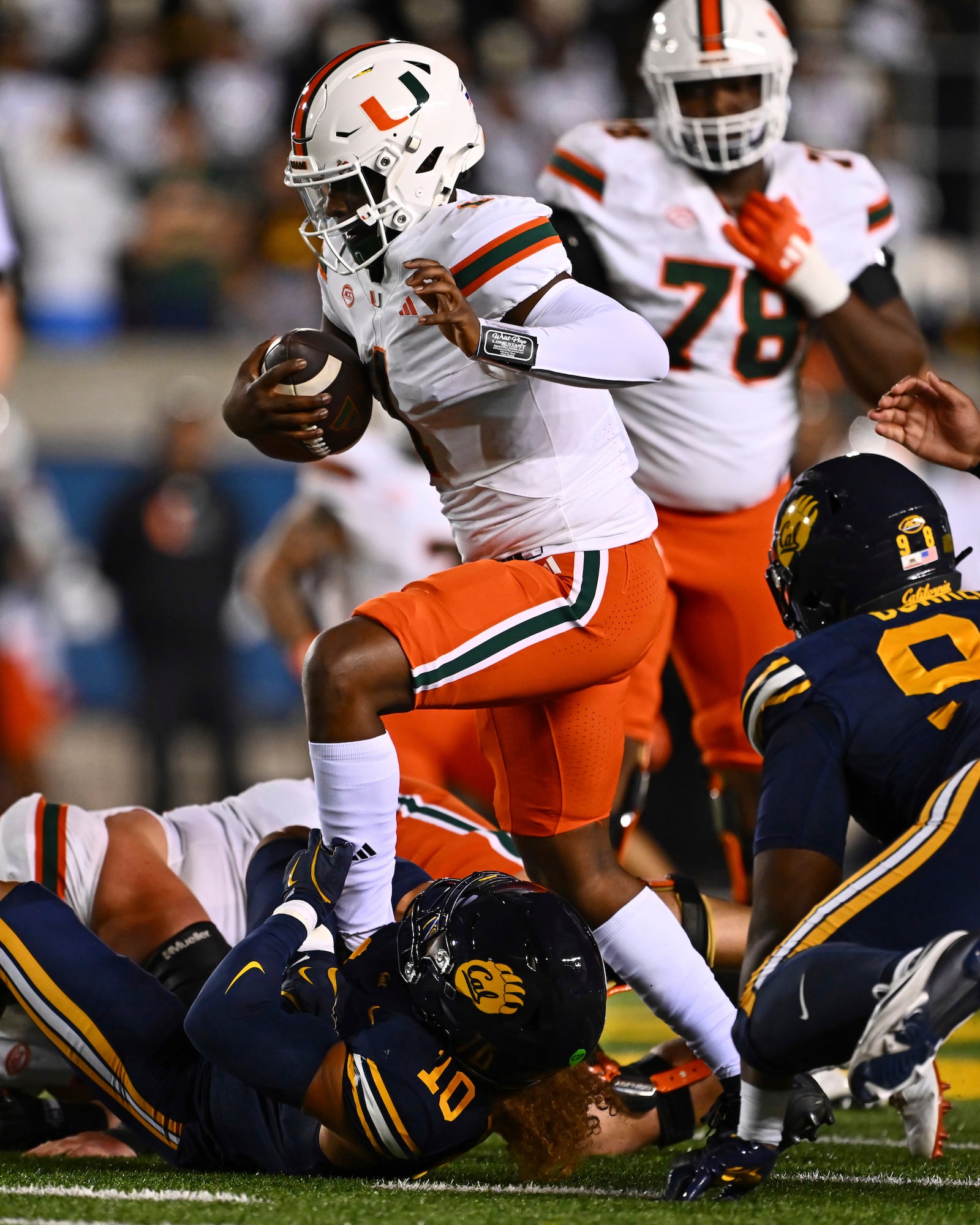 California linebacker Teddye Buchanan (10) sacks Miami quarterback Cam Ward (1) during the first quarter of their game at Memorial Stadium in Berkeley, Calif., on Saturday, Oct. 5, 2024. (Jose Carlos Fajardo/Bay Area News Group via AP)