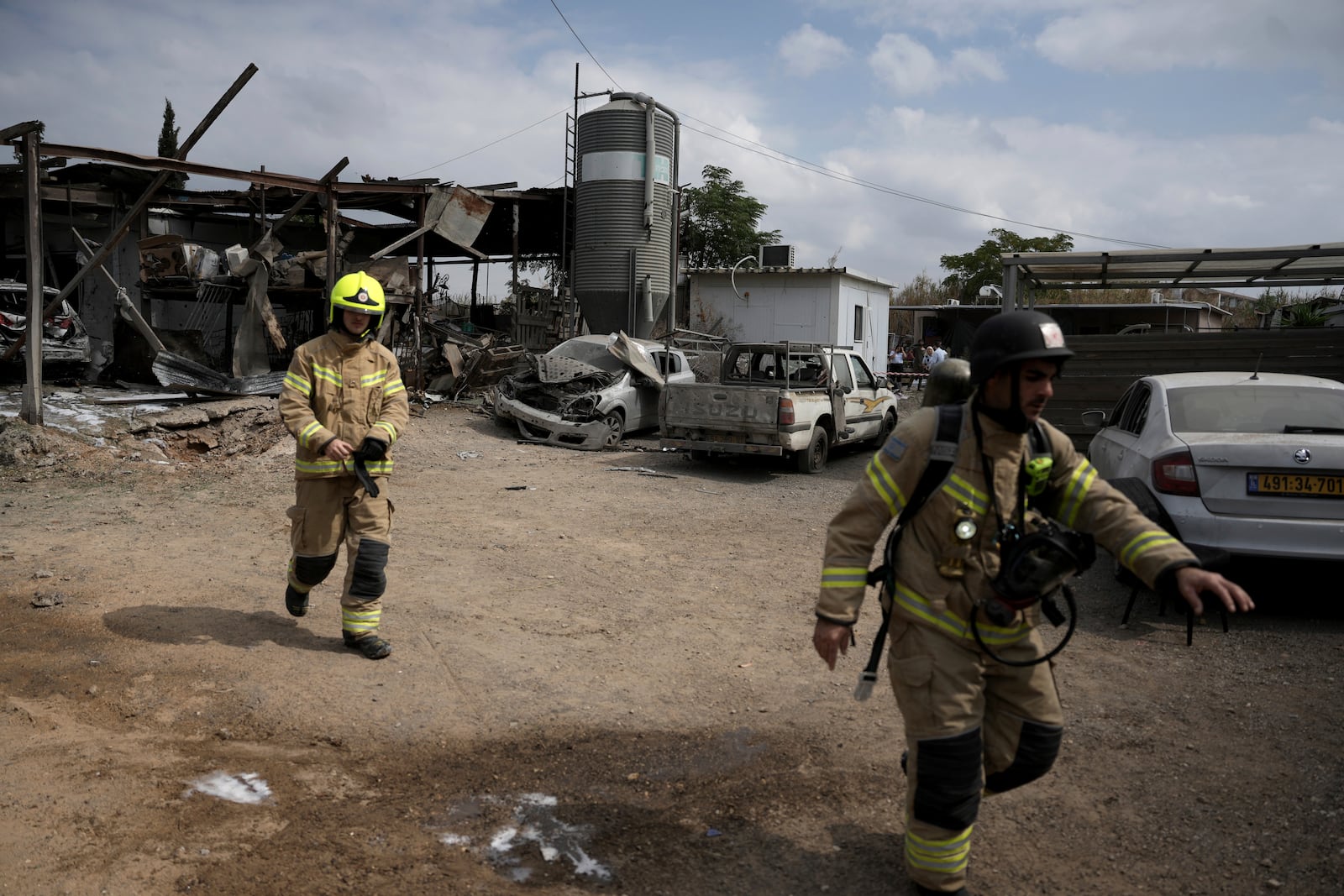 Emergency personnel respond after a rocket apparently fired from Gaza hits Kfar Chabad near Tel Aviv, Monday, Oct. 7, 2024. (AP Photo/Oded Balilty)