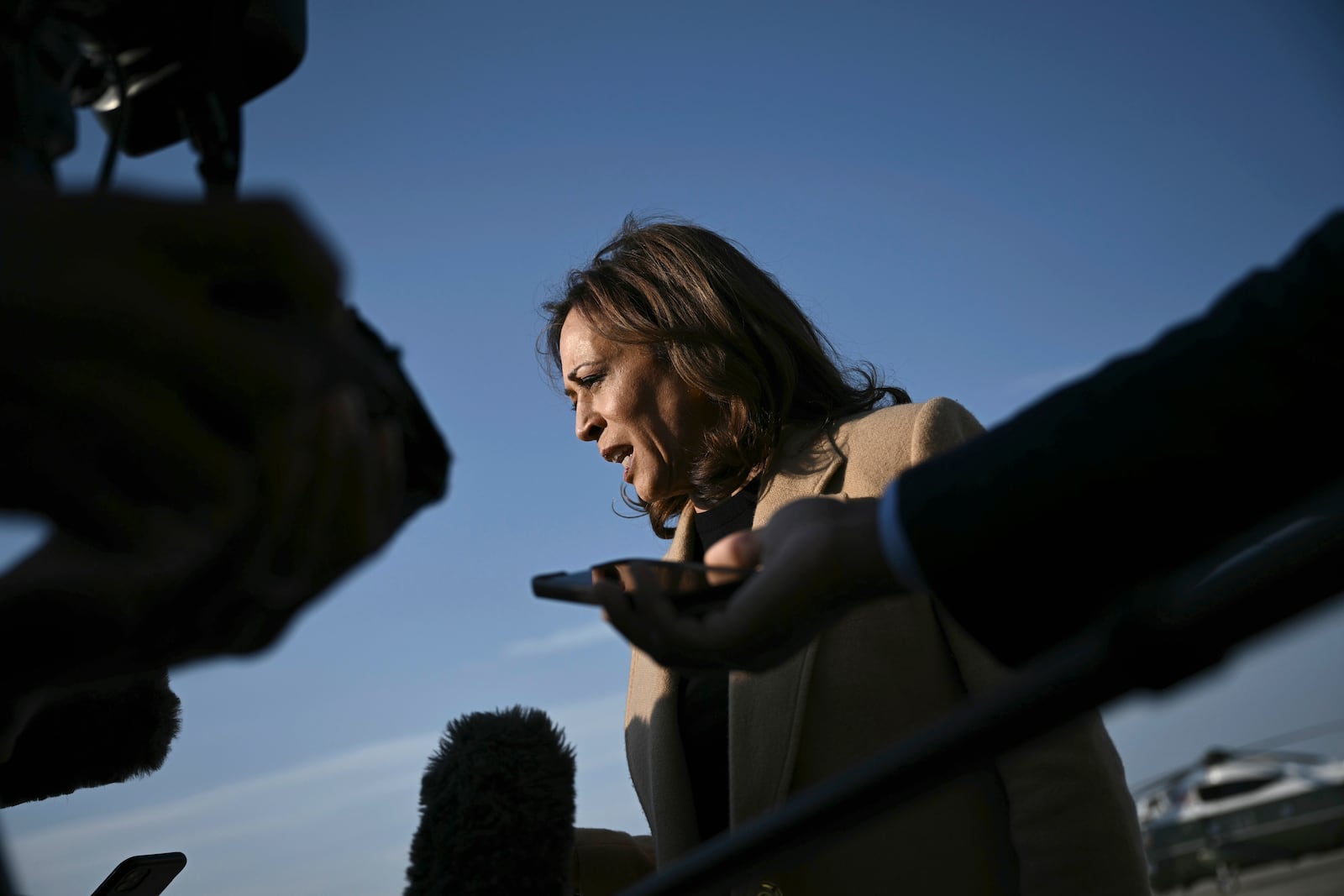 Democratic presidential nominee Vice President Kamala Harris speaks to the press before boarding Air Force Two at Joint Base Andrews, Md., Saturday, Oct. 12, 2024, en route to North Carolina for a campaign event. (Brendan Smialowski/Pool via AP)