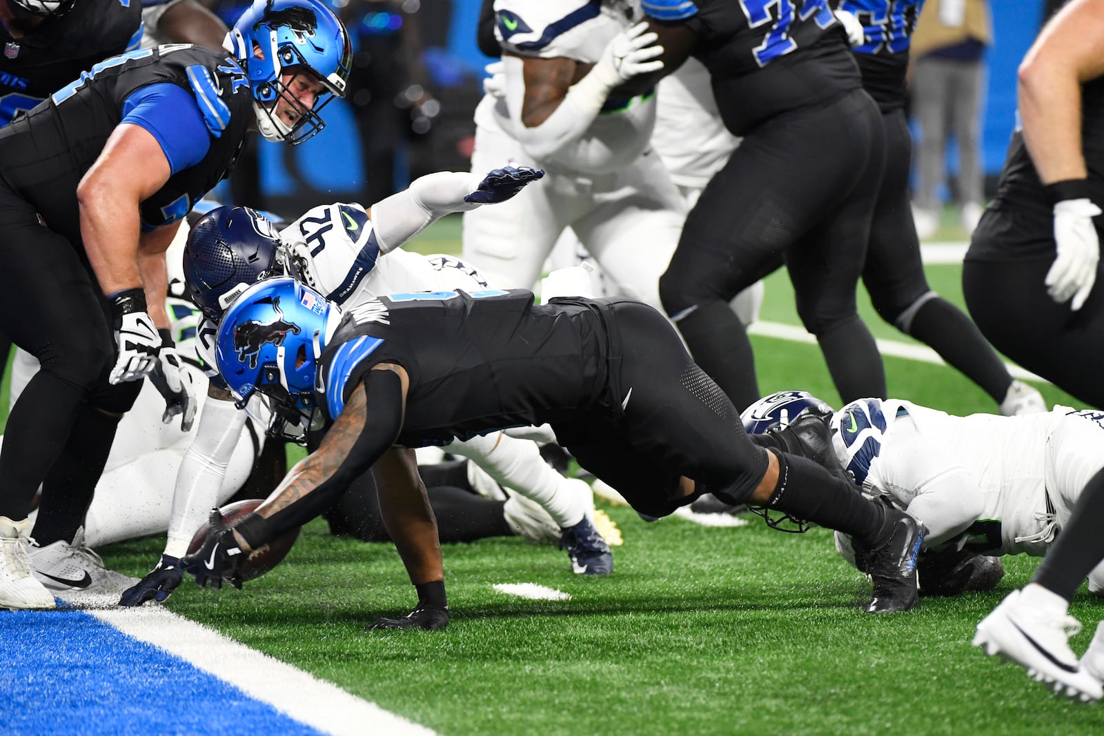 Detroit Lions running back David Montgomery falls into the endzone for a 1-yard rushing touchdown during the first half of an NFL football game against the Seattle Seahawks, Monday, Sept. 30, 2024, in Detroit. (AP Photo/Jose Juarez)