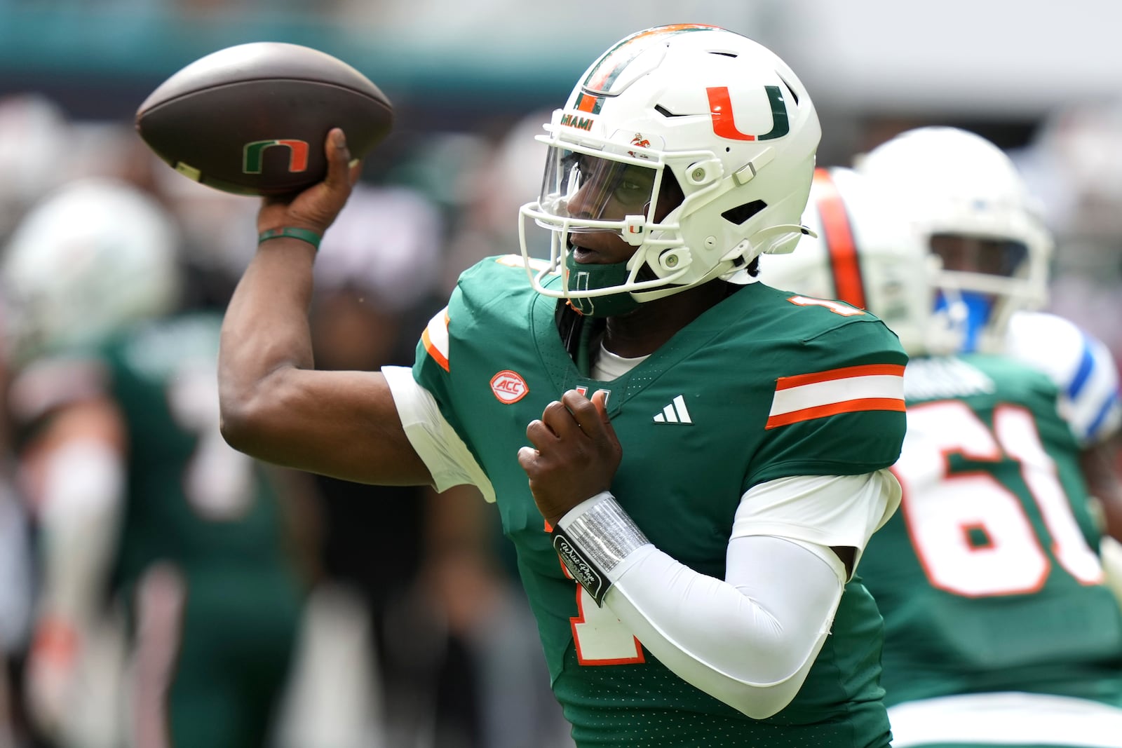 Miami quarterback Cam Ward (1) throws a pass during the first half of an NCAA college football game against Duke, Saturday, Nov. 2, 2024, in Miami Gardens, Fla. (AP Photo/Lynne Sladky)