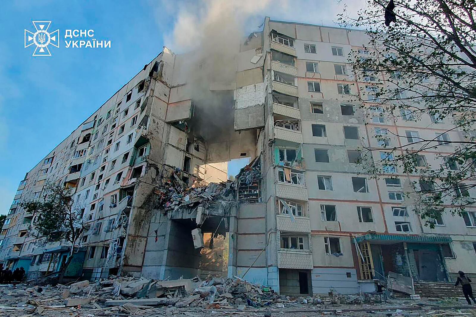 Smoke, dust and debris can be seen after after a Russian attack that hit a residential building in Kharkiv, Ukraine, Tuesday Sept. 24, 2024. (Ukrainian Emergency Services via AP)