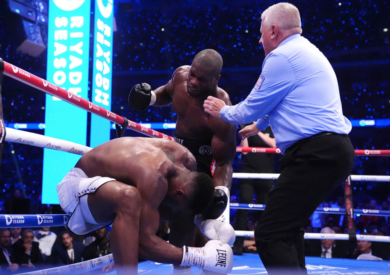 Anthony Joshua, left, and Daniel Dubois fight in the IBF World Heavyweight bout at Wembley Stadium, in London, Saturday, Sept. 21, 2024. (Bradley Collyer/PA via AP)