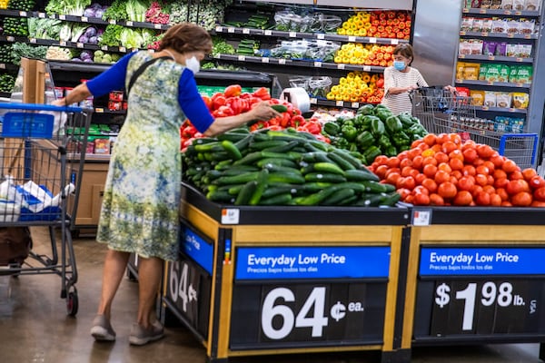 FILE - People buy groceries at a Walmart Superstore in Secaucus, New Jersey, July 11, 2024. (AP Photo/Eduardo Munoz Alvarez, File)