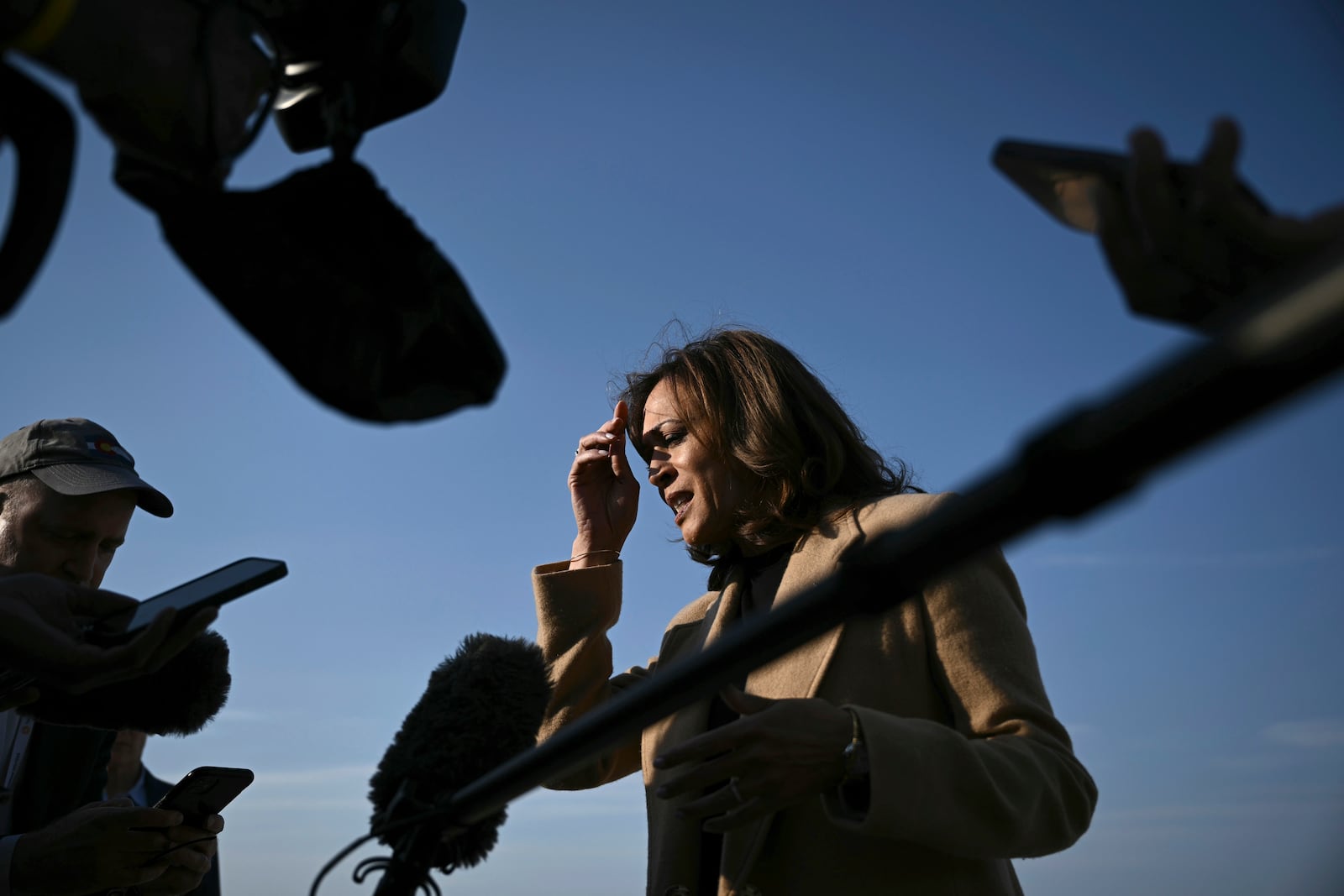 Democratic presidential nominee Vice President Kamala Harris speaks to the press before boarding Air Force Two at Joint Base Andrews, Md., Saturday, Oct. 12, 2024, en route to North Carolina for a campaign event. (Brendan Smialowski/Pool via AP)