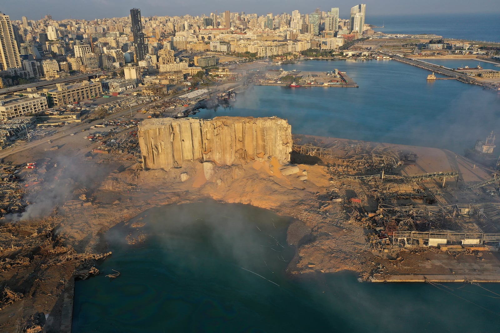 FILE - A drone picture shows the scene of an explosion that hit the seaport of Beirut, Lebanon, on Aug. 5, 2020. (AP Photo/Hussein Malla, File)