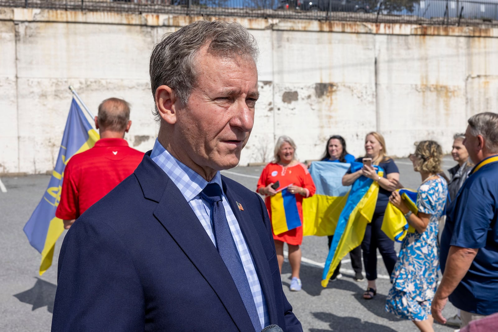 U.S. Rep. Matt Cartwright, PA-08, talks to Ukraine supporters before President of Ukraine Volodymyr Zelenskyy's motorcade arrives at the Scranton Army Ammunition Plant in Scranton on Sunday, Sept. 22, 2024. The plant manufactures artillery ammunition which is used in Ukraine. (AP Photo/Laurence Kesterson)