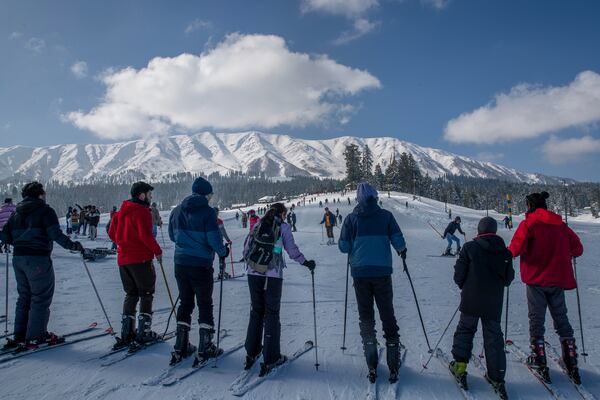 FILE - Tourists wait for their turn to use a ski-lift to transport them up a slope in Gulmarg, northwest of Srinagar, Indian controlled Kashmir, Jan. 10, 2021. (AP Photo/Dar Yasin, File)