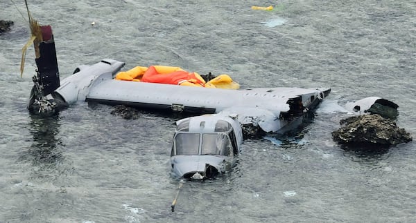 FILE - Wreckage of a U.S. military MV-22 Osprey is seen in shallow waters off Nago, Okinawa, southern Japan, Dec. 14, 2016, after it crash landed. (Yu Nakajima/Kyodo News via AP, File)