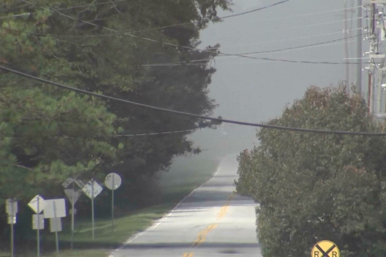 In this image taken from video from WSB-TV, smoke fills the air from a fire at the nearby BioLab plant, Sunday, Sept. 29, 2024, in Conyers, Ga. (WSB-TV via AP)