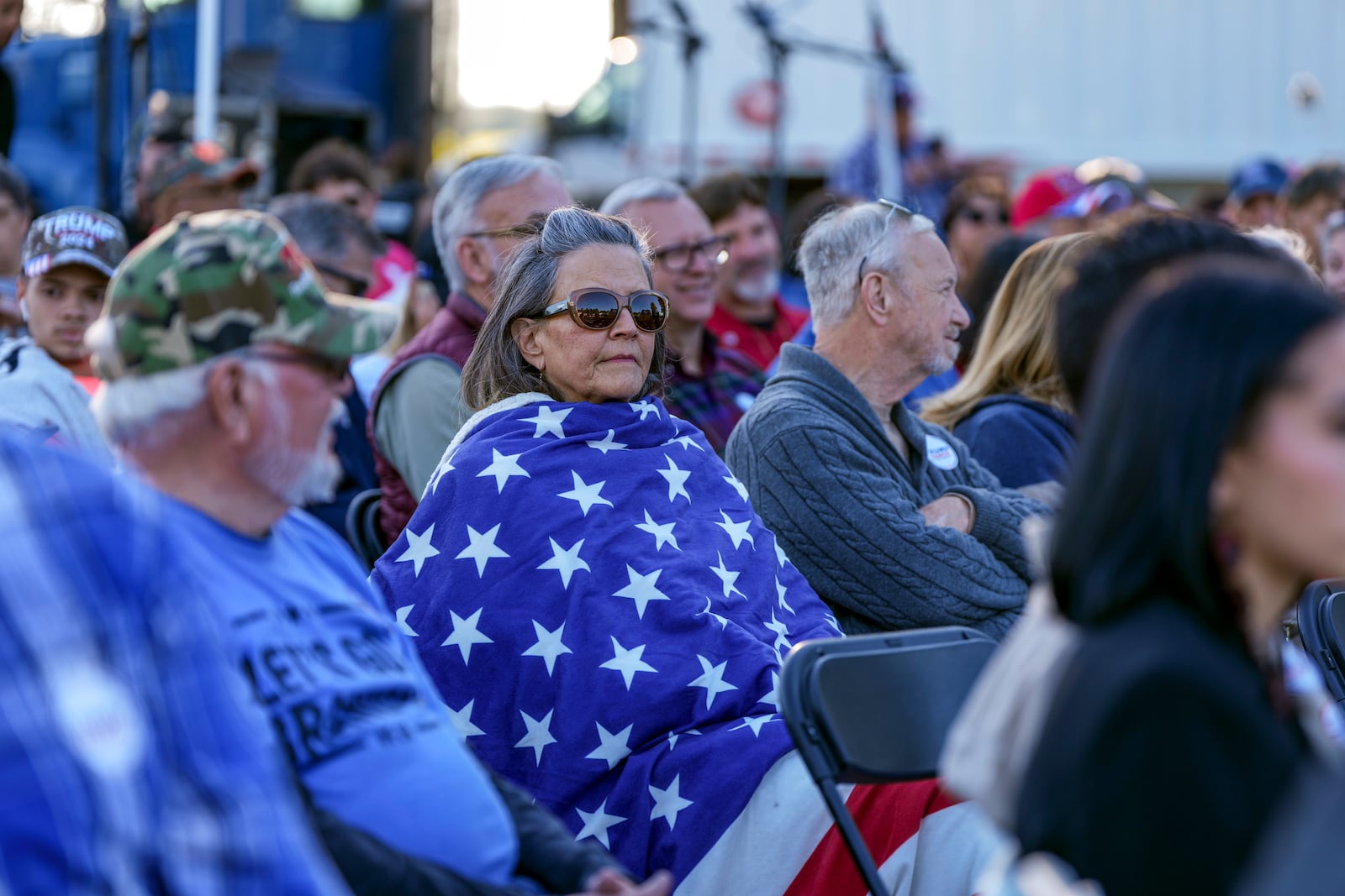 Supporter listen during a campaign event in support of Republican presidential candidate former President Donald Trump, Friday, Oct. 18, 2024, in Red Springs, N.C. (AP Photo/David Yeazell)