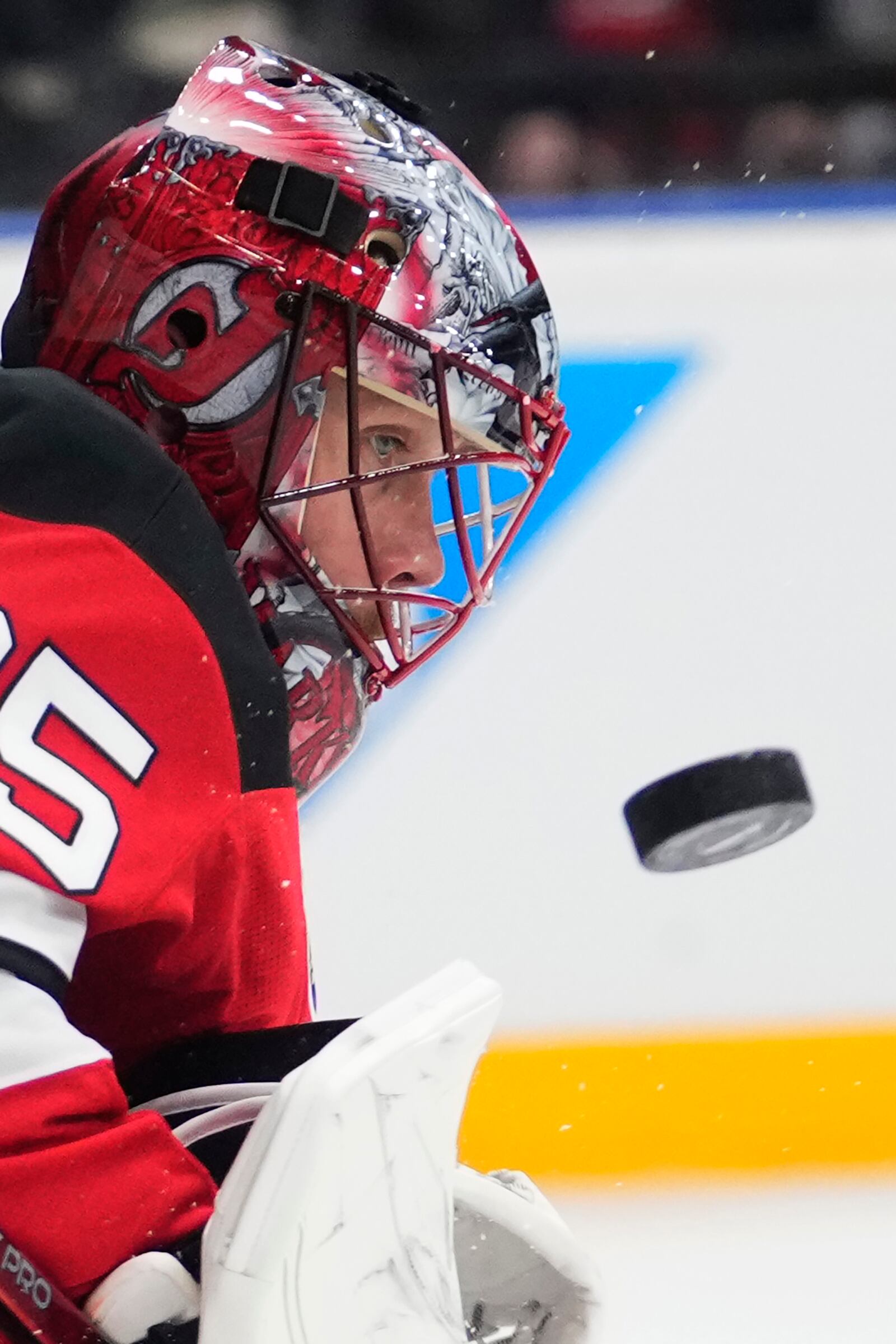 New Jersey goaltender Devils' Jacob Markstrom watches the puck during the NHL hockey game between Buffalo Sabres and New Jersey Devils, in Prague, Czech Republic, Friday, Oct. 4, 2024. (AP Photo/Petr David Josek)