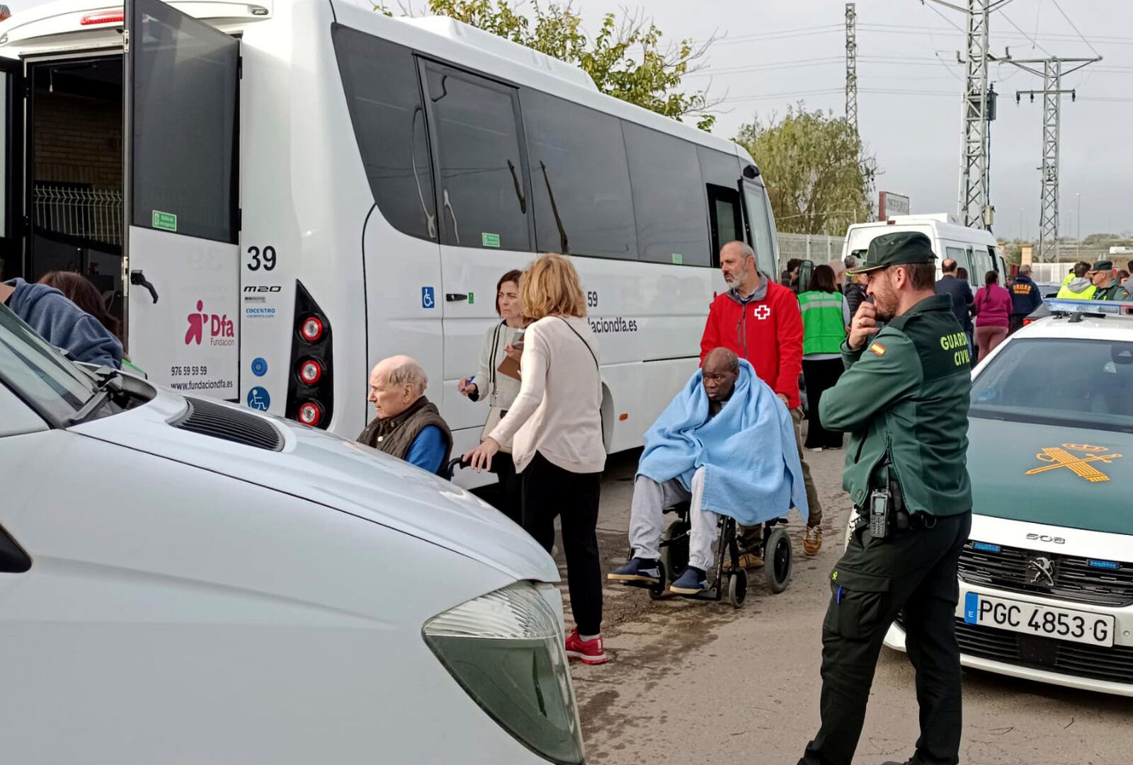 Residents are moved out of the nursing home where least 10 people have died in a fire in Zaragoza, Spain, Friday, Nov. 15, 2024. (AP Photo/Ferran Mallol )