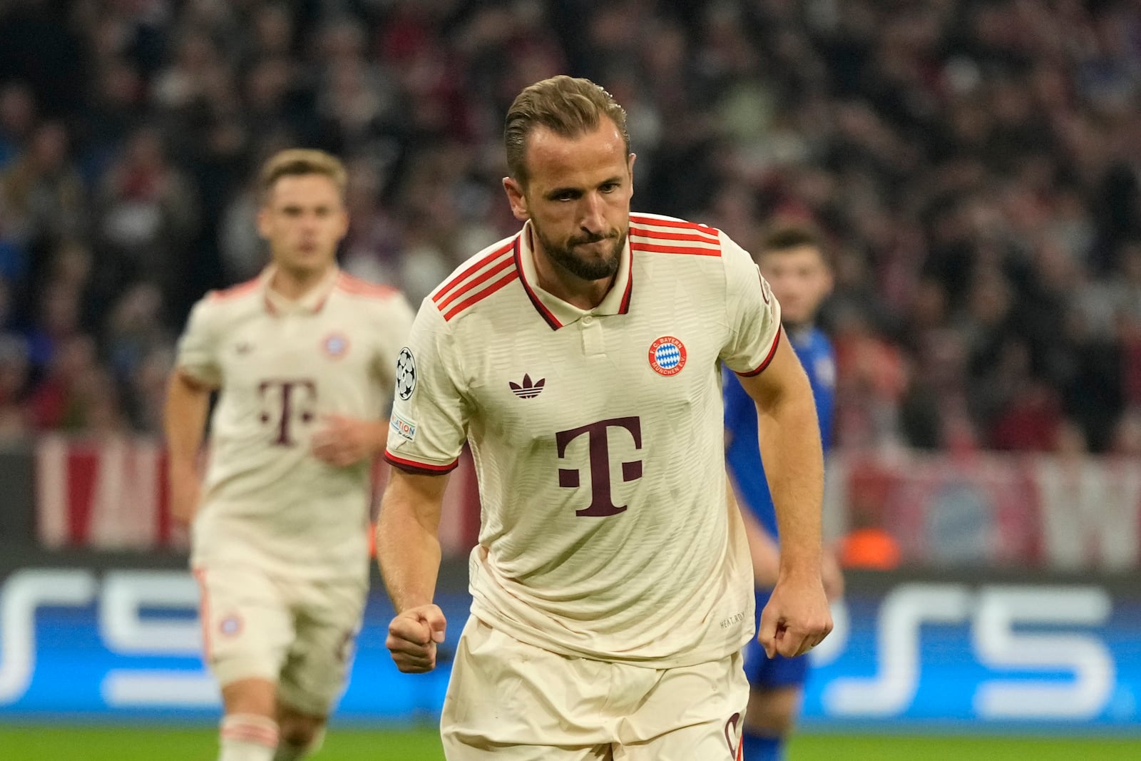 Bayern's Harry Kane celebrates after scoring the opening goal from the penalty sport during the Champions League opening phase soccer match between Bayern Munich and GNK Dinamo at the Allianz Arena in Munich, Germany Tuesday, Sept. 17, 2024. (AP Photo/Matthias Schrader)