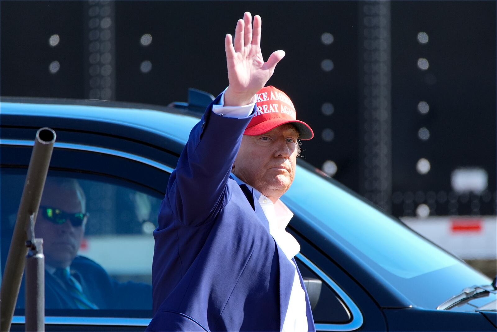 Republican presidential nominee former President Donald Trump waves after speaking at a campaign rally at Wilmington International Airport, Saturday, Sept. 21, 2024, in Wilmington, N.C. (AP Photo/Alex Brandon)