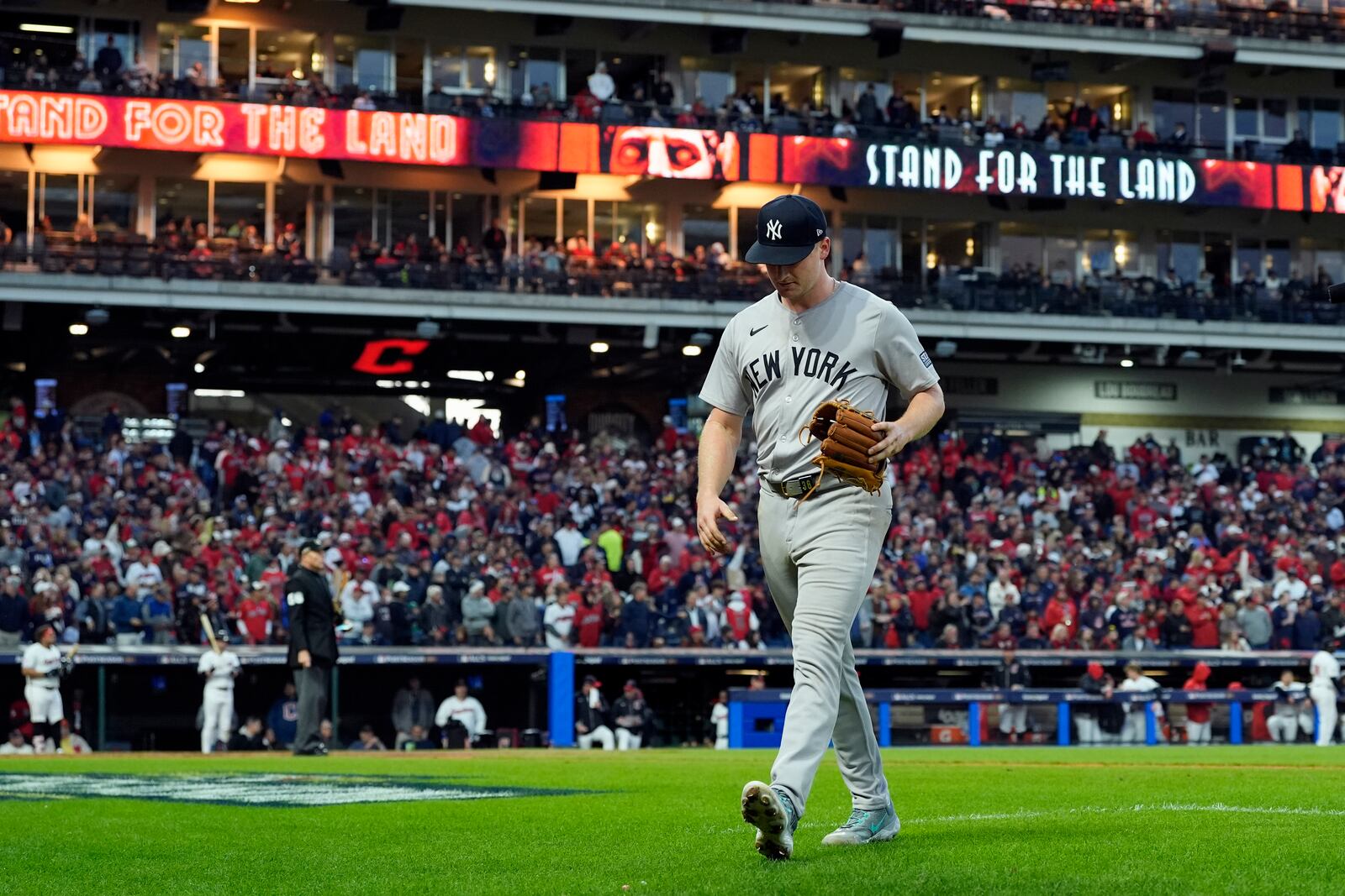 New York Yankees starting pitcher Clarke Schmidt leaves the game during the fifth inning in Game 3 of the baseball AL Championship Series against the Cleveland Guardians Thursday, Oct. 17, 2024, in Cleveland.(AP Photo/Godofredo Vásquez )