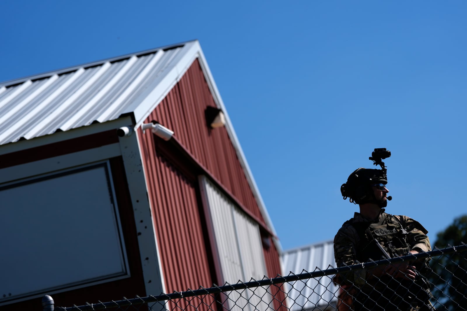 Law enforcement monitors the site before Republican presidential nominee former President Donald Trump speaks at a campaign rally at the Butler Farm Show, Saturday, Oct. 5, 2024, in Butler, Pa. (AP Photo/Julia Demaree Nikhinson)