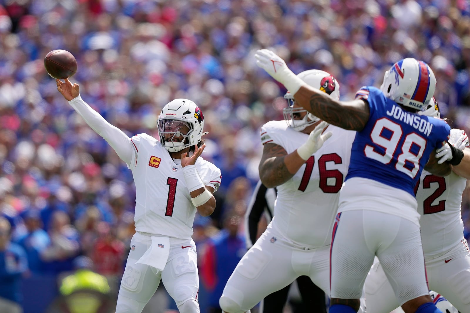 Arizona Cardinals quarterback Kyler Murray (1) throws the ball as Cardinals guard Will Hernandez (76) blocks Buffalo Bills defensive tackle Austin Johnson (98) during the first half of an NFL football game Sunday, Sept. 8, 2024, in Orchard Park, N.Y. (AP Photo/Matt Slocum)