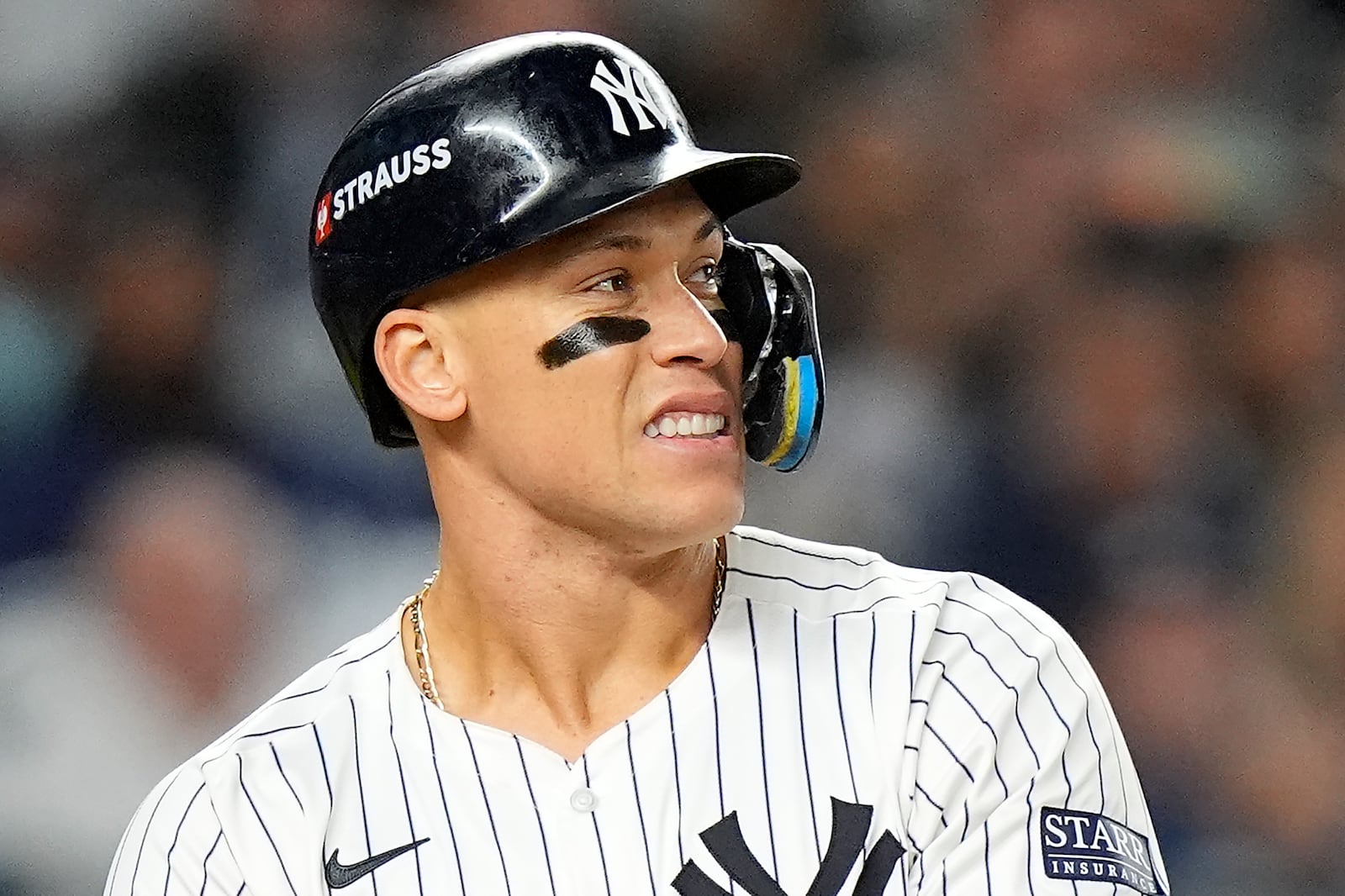 New York Yankees' Aaron Judge reacts as he takes a walk against the Kansas City Royals during the fifth inning of Game 2 of the American League baseball playoff series, Monday, Oct. 7, 2024, in New York. (AP Photo/Frank Franklin II)