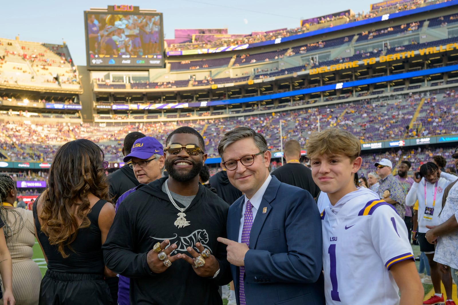 U.S. Speaker of the House, Rep. Michael Johnson (R-La.) takes a picture with Clyde Edwards-Helaire, the Kansas City Chiefs and formerly LSU, before an NCAA college football game against Mississippi in Baton Rouge, La., Saturday, Oct. 12, 2024. (AP Photo/Matthew Hinton)