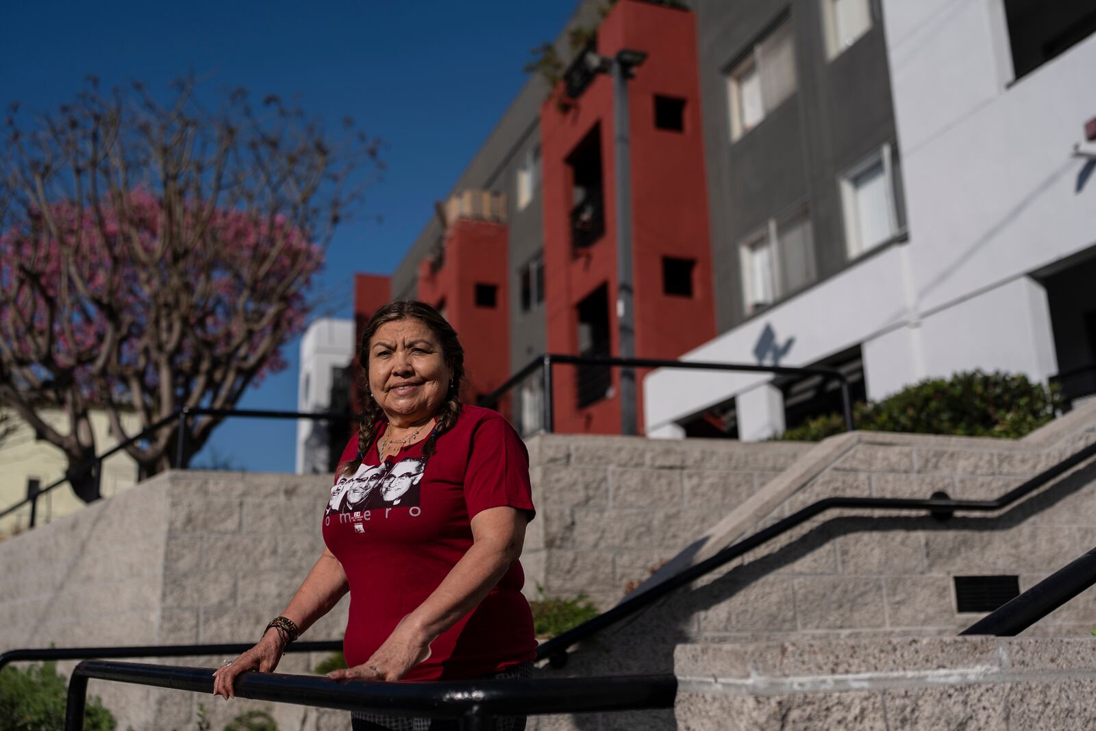 Marina Maalouf, a longtime resident of Hillside Villa who participated in protests after rents doubled in 2019, stands for a photo outside her apartment building in Los Angeles on Wednesday, Sept. 18, 2024. (AP Photo/Jae C. Hong)