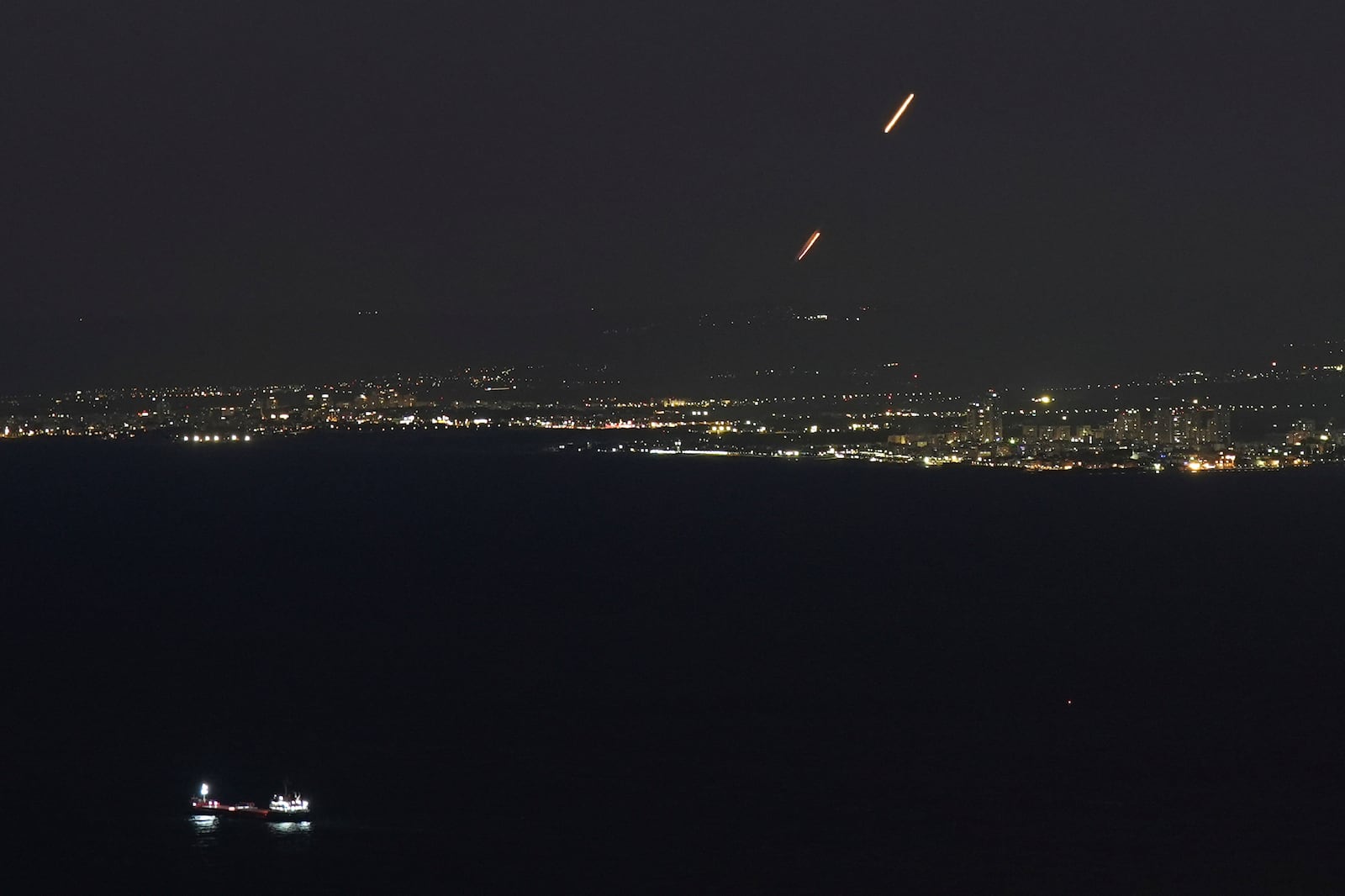 Israeli Iron Dome air defense system fires to intercept rockets that were launched from Lebanon, as seen from Haifa, northern Israel, Thursday, Sept. 26, 2024. (AP Photo/Baz Ratner)