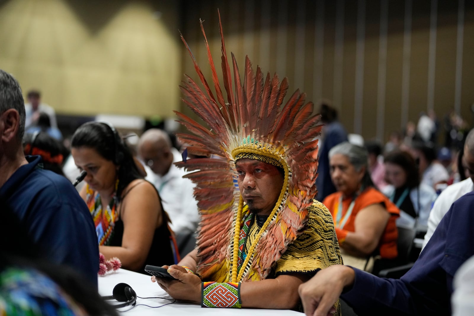 An Indigenous Brazilian delegate attends the opening ceremony of COP16, a United Nations' biodiversity conference, in Cali, Colombia, Sunday, Oct. 20, 2024. (AP Photo/Fernando Vergara)