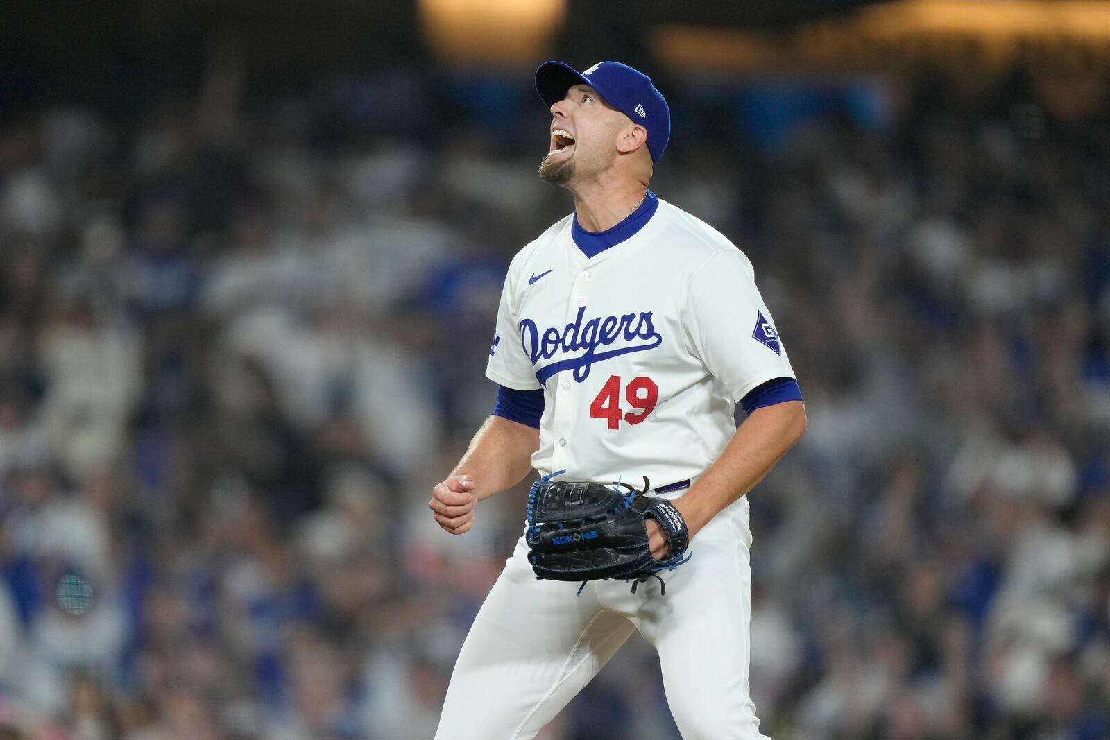 Los Angeles Dodgers pitcher Blake Treinen reacts after striking out San Diego Padres' Manny Machado for the final out of the ninth inning in Game 1 of baseball's NL Division Series, Saturday, Oct. 5, 2024, in Los Angeles. (AP Photo/Mark J. Terrill)