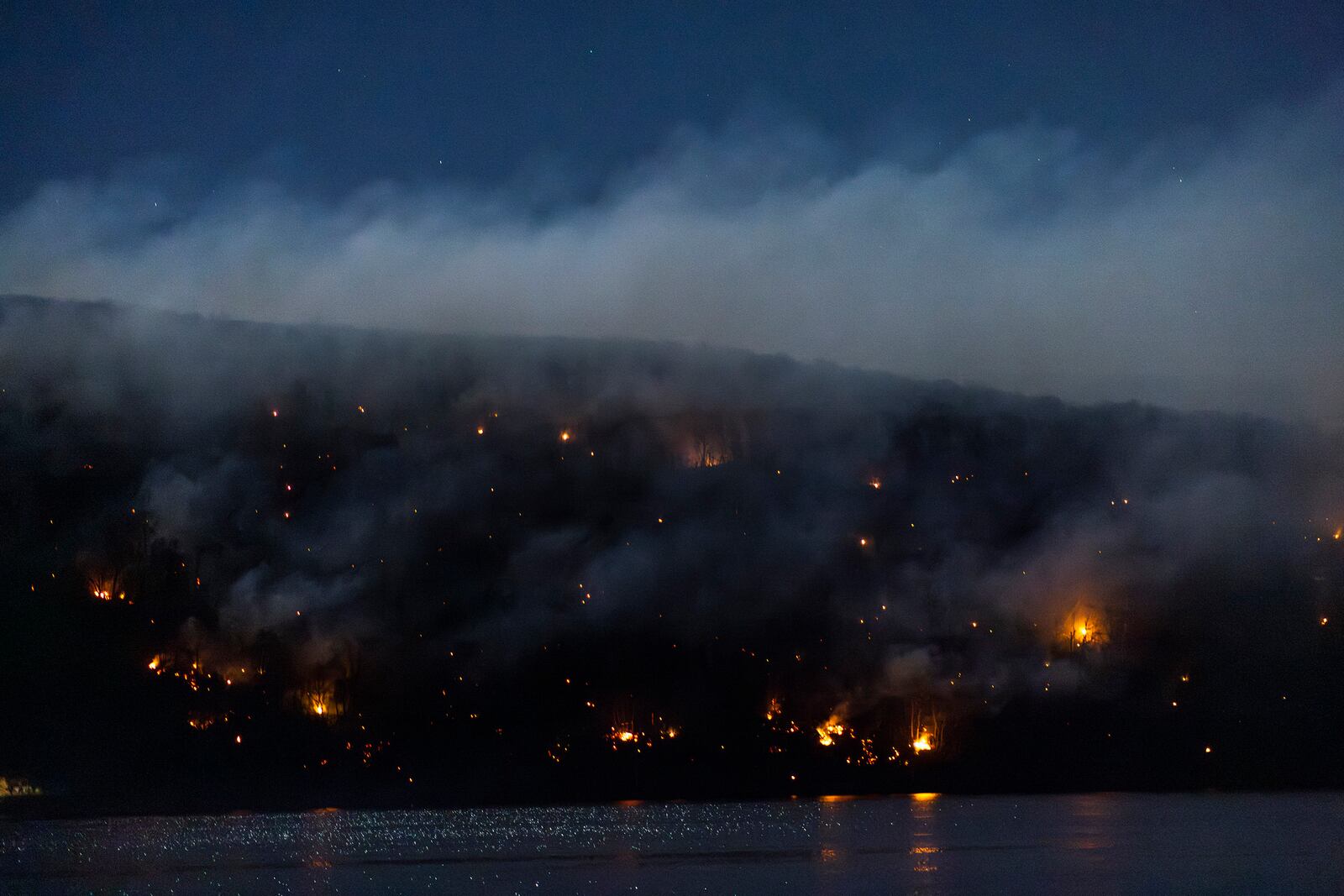 Wildfires burn along the New York and New Jersey border in Greenwood Lake, New York, Wednesday, Nov. 13, 2024. (AP Photo/Eduardo Munoz Alvarez)