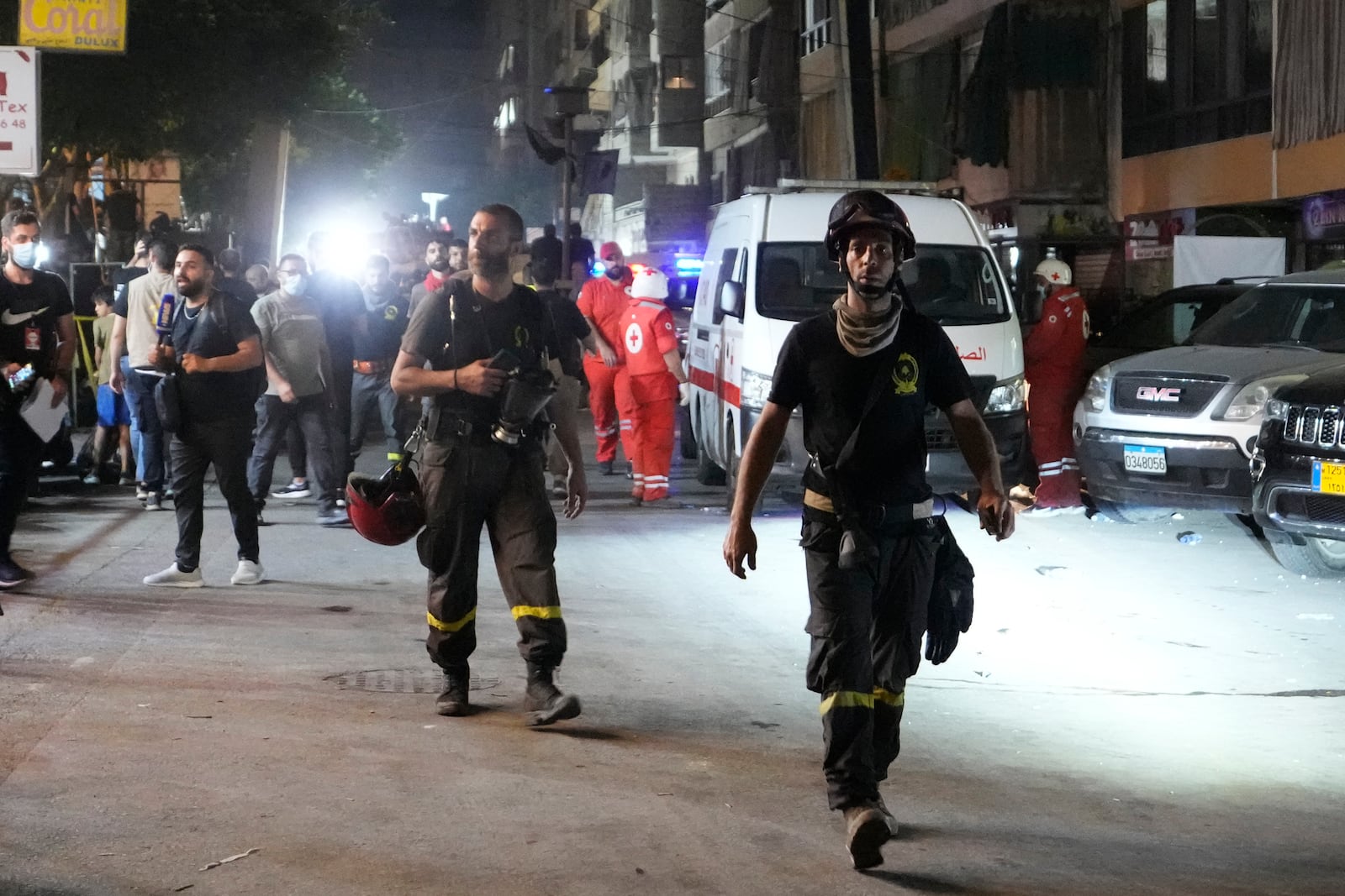 Rescuers work at the scene of an Israeli missile strike in the southern suburbs of Beirut, Friday, Sept. 20, 2024. (AP Photo/Hassan Ammar)