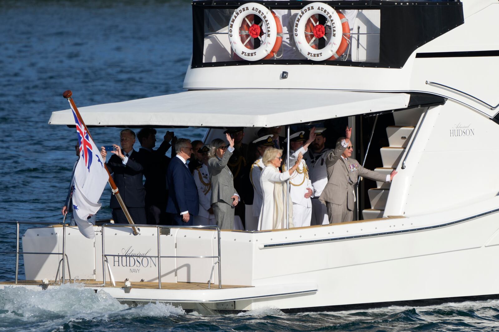 Britain's King Charles III, right, and Queen Camilla rides a yacht along the harbor in Sydney, Australia, Tuesday, Oct. 22, 2024. (AP Photo/Mark Baker, Pool)