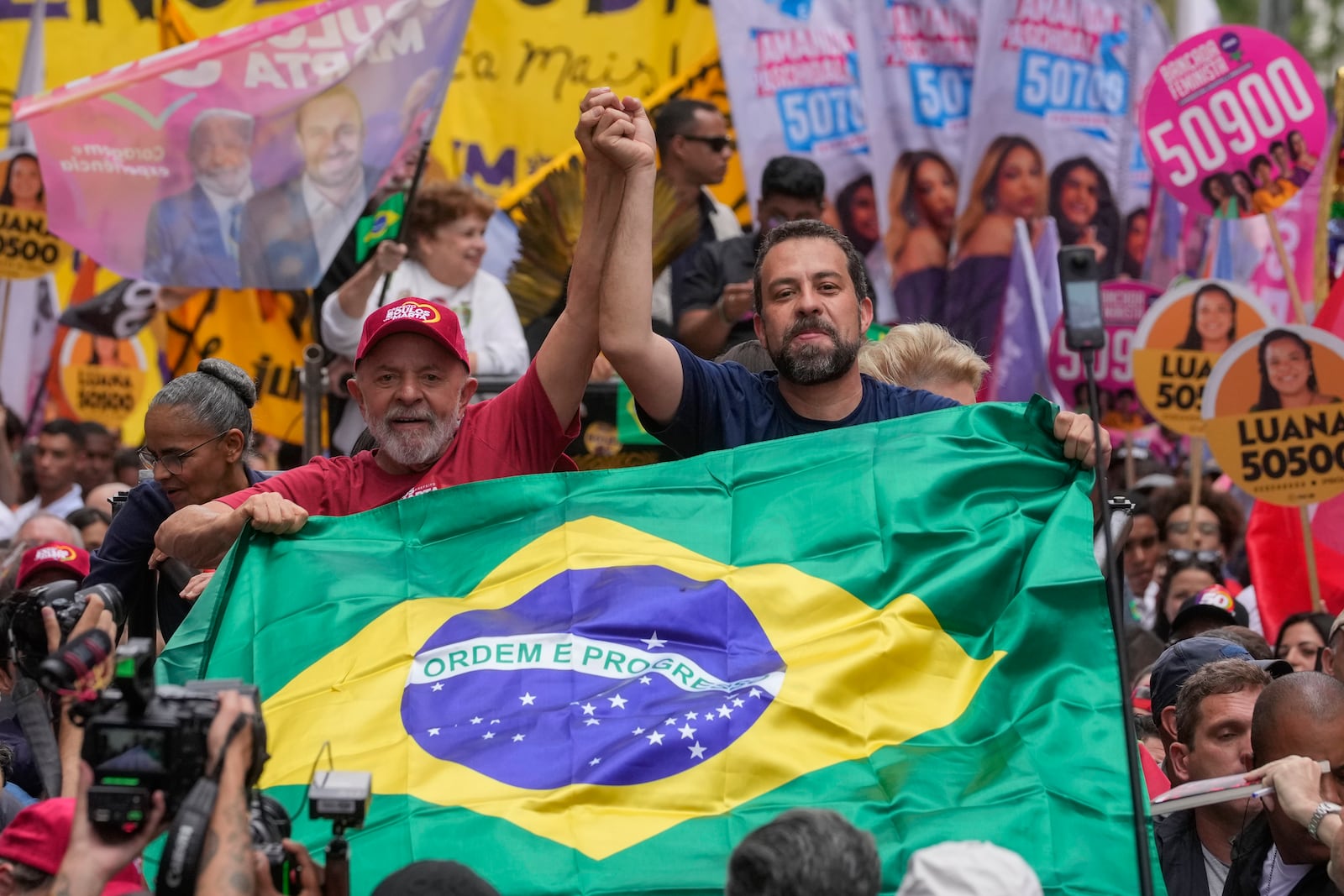 Brazilian President Luiz Inacio Lula da Silva, left, campaigns with mayoral candidate Guilherme Boulos of the Socialism and Liberty Party the day before elections in Sao Paulo, Saturday, Oct. 5, 2024. (AP Photo/Andre Penner)