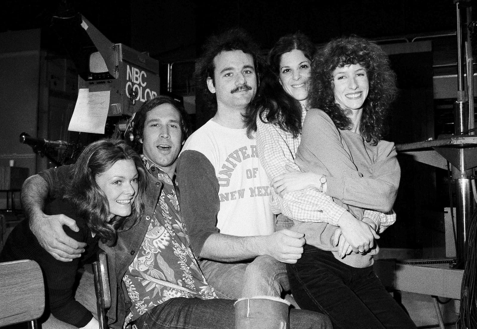 FILE - Comedian Chevy Chase, second from left, joins the cast of NBC's "Saturday Night Live," with Laraine Newman, from right, Gilda Radner, Bill Murray and Jane Curtain, left, on Feb. 16, 1978 in New York. (AP Photo/Marty Lederhandler, File)