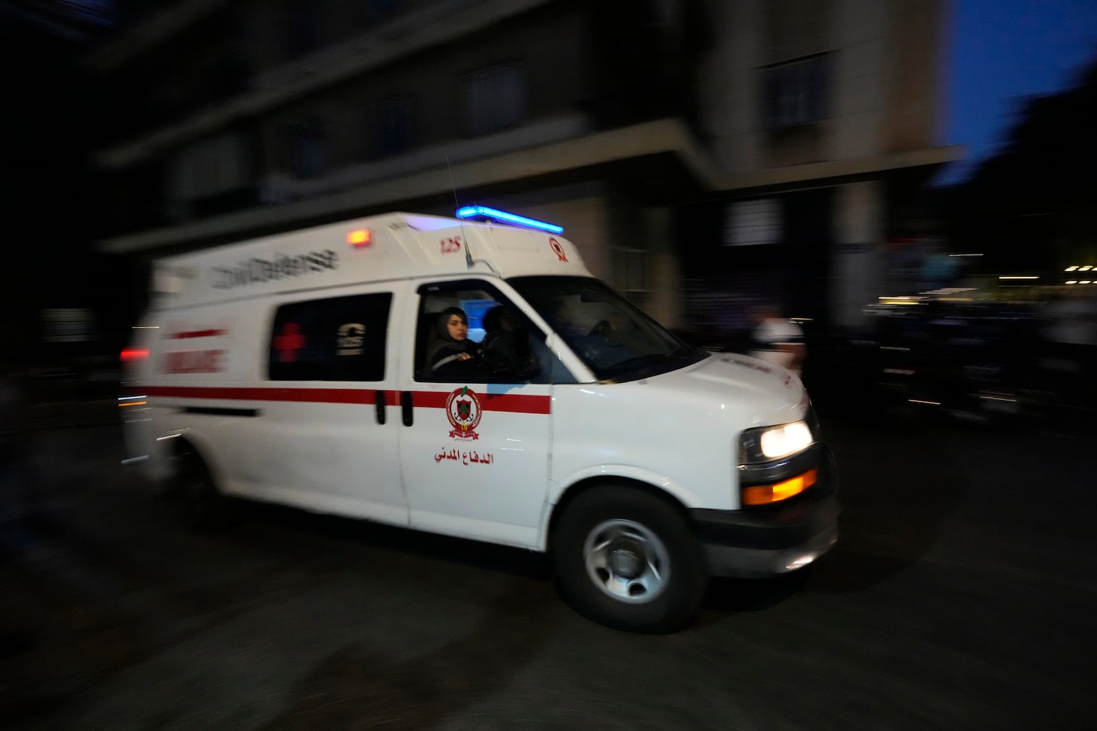 An ambulance carrying wounded people whose handheld pager exploded, arrive at the American University hospital in Beirut, Lebanon, Tuesday, Sept. 17, 2024. (AP Photo/Hassan Ammar)