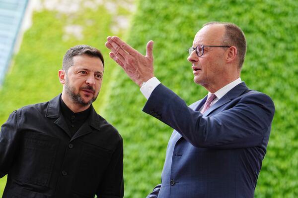 German Chancellor Friedrich Merz, right, welcomes Ukrainian President Volodymyr Zelenskyy for a meeting in Berlin, Germany, Wednesday, May 28, 2025. (Kay Nietfeld/dpa via AP)
