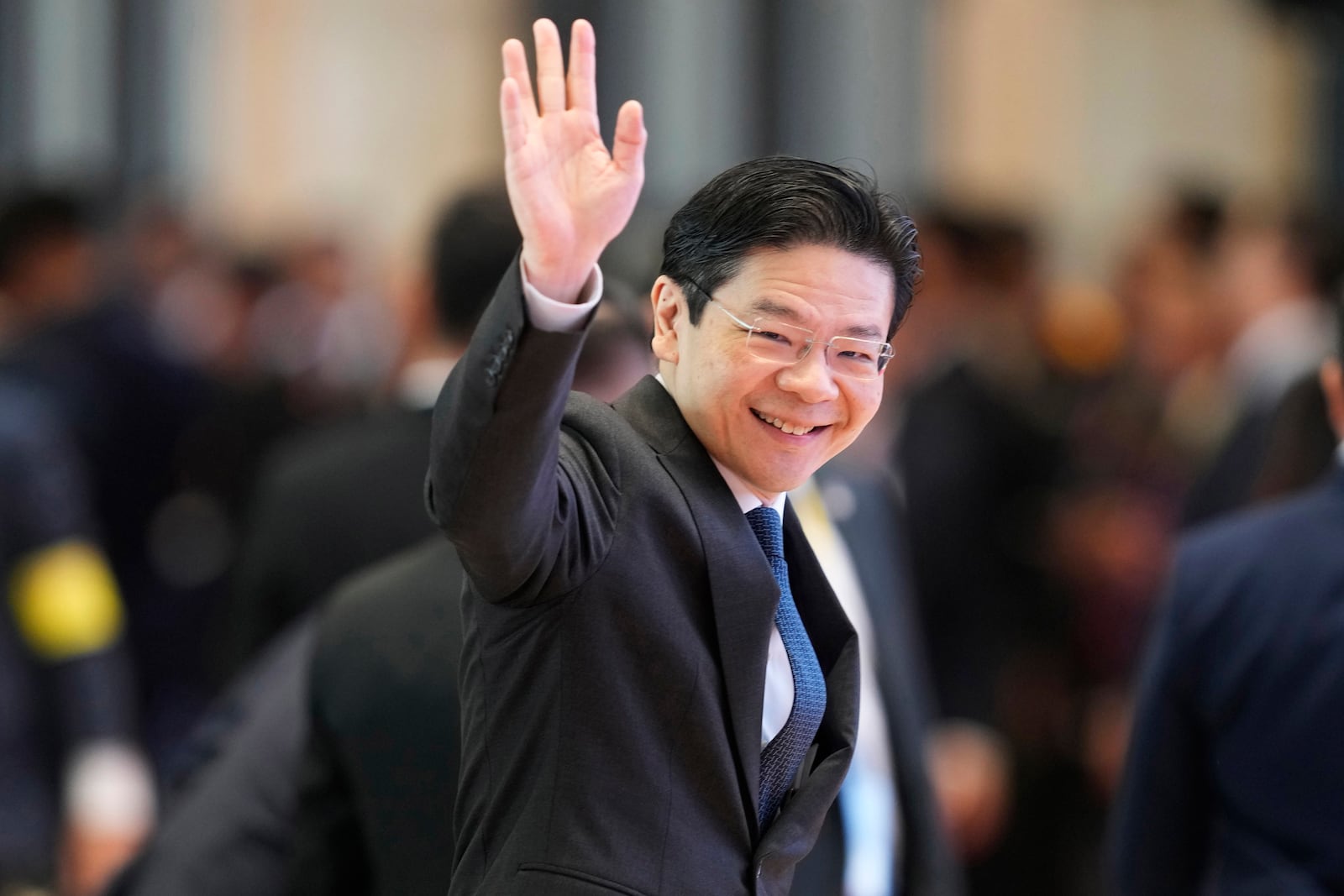 Singapore's Prime Minister Lawrence Wong arrives to participate in ASEAN-China summit in Vientiane, Laos, Thursday, Oct. 10, 2024. (AP Photo/Sakchai Lalit)