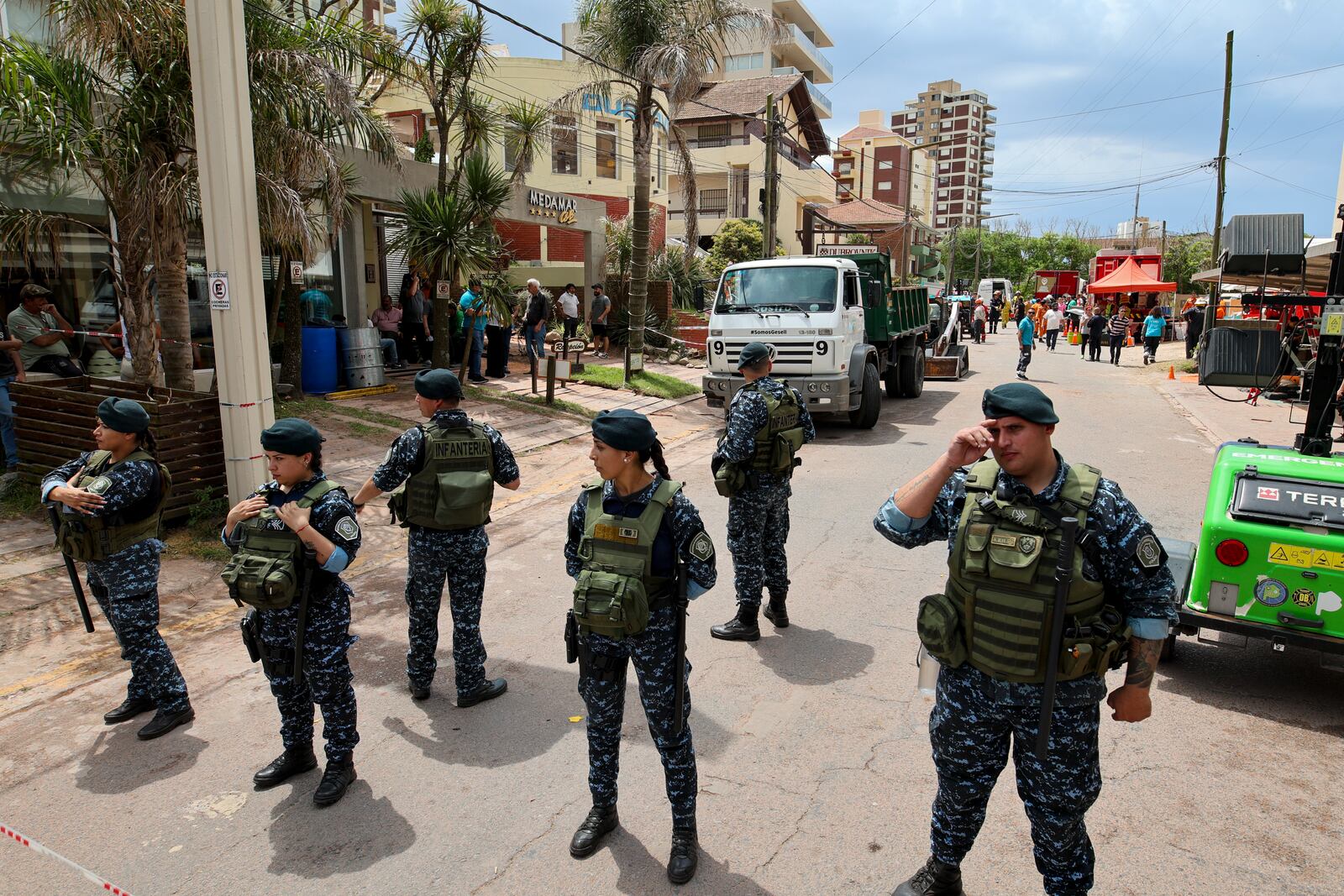 Police block a street leading to the Dubrovnik Hotel where firefighters and rescuers work to find survivors after the hotel collapsed, in Villa Gesell, Argentina, Tuesday, Oct. 29, 2024. (AP Photo/Christian Heit)