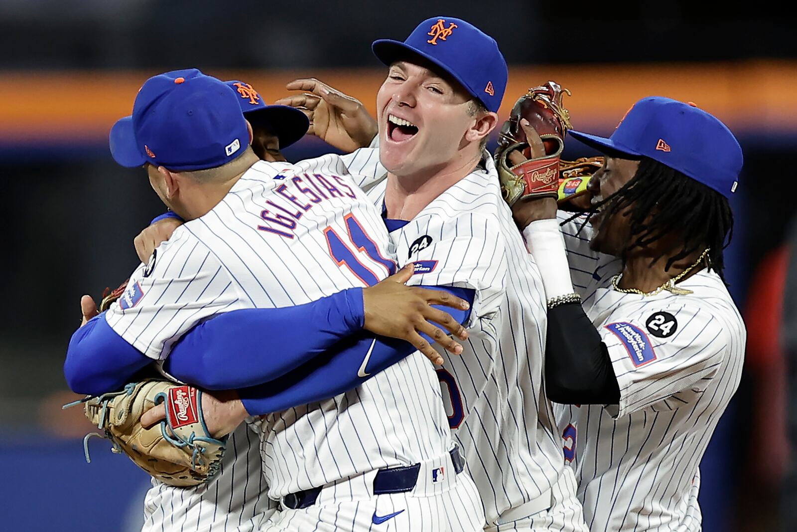 The New York Mets celebrate after defeating the Philadelphia Phillies in Game 4 of the National League baseball playoff series, Wednesday, Oct. 9, 2024, in New York. (AP Photo/Adam Hunger)