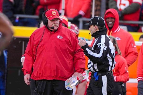 Kansan city Chiefs head coach Andy Reid talks with side judge Dave Hawkshaw (107) during the first half of an NFL football game against the Las Vegas Raiders in Kansas City, Mo., Friday, Nov. 29, 2024. (AP Photo/Charlie Riedel)