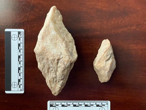 This undated photo provided by Philip LaPorta shows two bipointed quarry picks fashioned from quartz mylonite that were uncovered during an archaeological survey of the Seniard Creek Fire scar south of Asheville, North Carolina. (Philip LaPorta via AP)