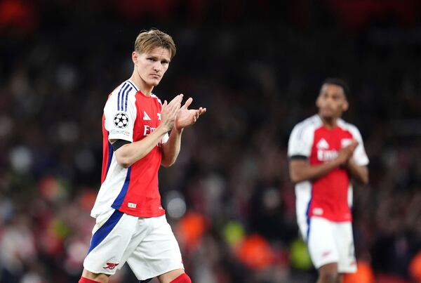 Arsenal's Martin Odegaard applauds the fans following the Champions League semifinal first leg soccer match between Arsenal and Paris Saint-Germain at Emirates Stadium in London, England, Tuesday, April 29, 2025. (Adam Davy/PA via AP)