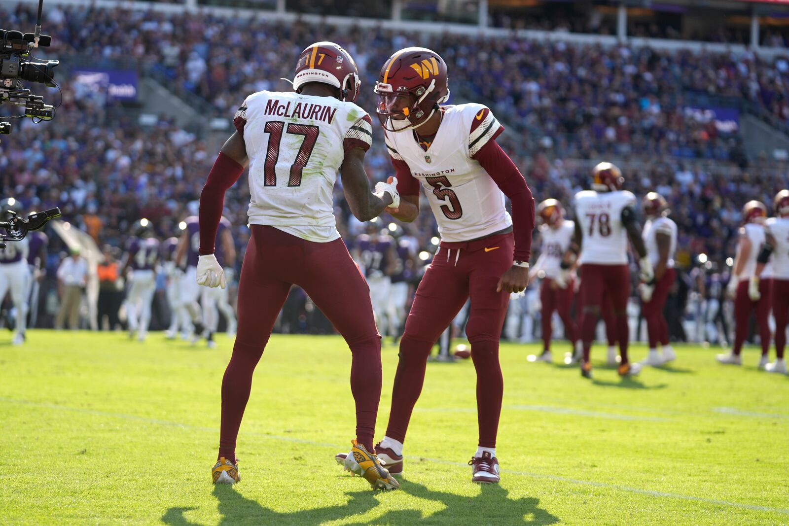 Washington Commanders wide receiver Terry McLaurin (17) celebrates after catching a 6-yard touchdown pass from quarterback Jayden Daniels (5) during the second half of an NFL football game against the Baltimore Ravens Sunday, Oct. 13, 2024, in Baltimore. (AP Photo/Stephanie Scarbrough)