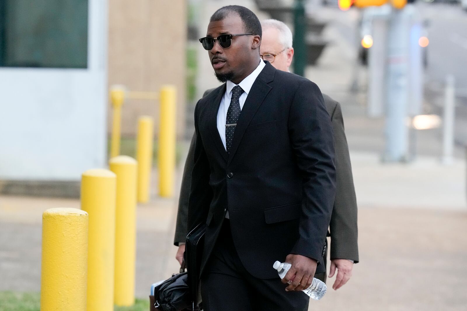 Former Memphis police officer Justin Smith arrives at the federal courthouse for the day's proceedings during the trial in the Tyre Nichols case Wednesday, Sept. 25, 2024, in Memphis, Tenn. (AP Photo/George Walker IV)