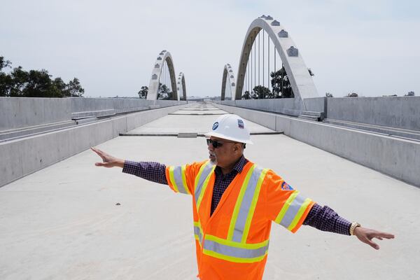 Garth Fernandez, Central Valley regional director for the California High-Speed Rail Authority, talks about the Cedar Viaduct, Tuesday, April 15, 2025, in Fresno, Calif. (AP Photo/Godofredo A. Vásquez)