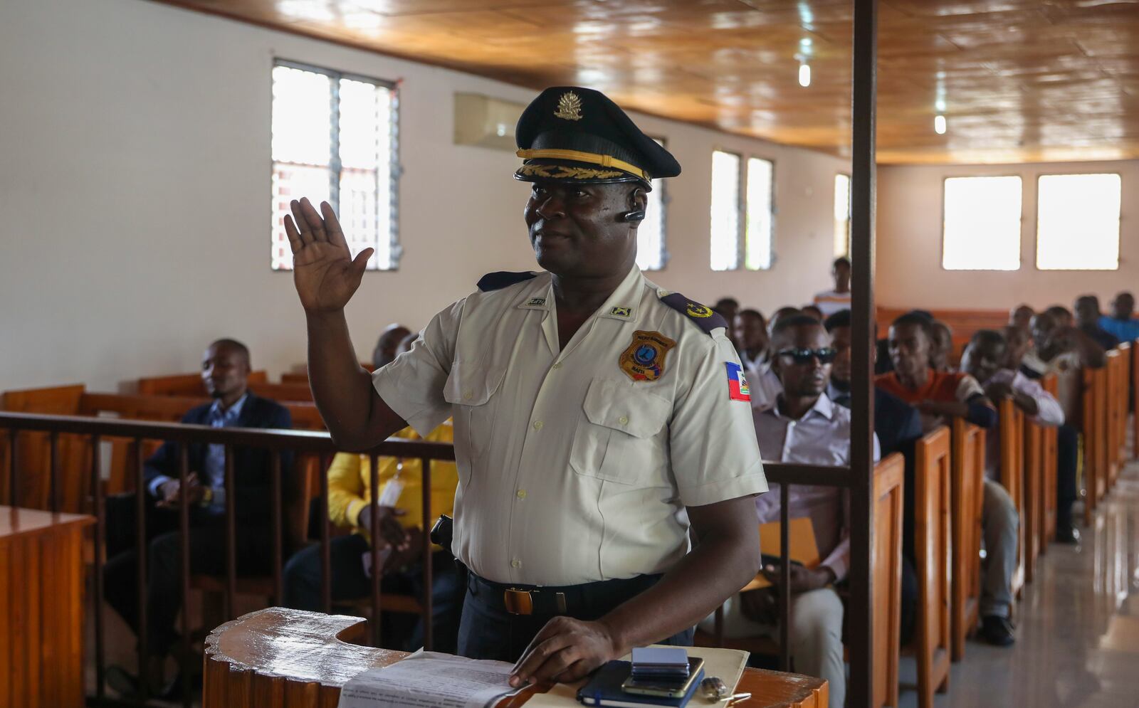 Max Altis is sworn in as the new police commissioner in Saint-Marc, Haiti, Wednesday, Oct. 9, 2024, days after a deadly gang attack in a nearby town. (AP Photo/Odelyn Joseph)