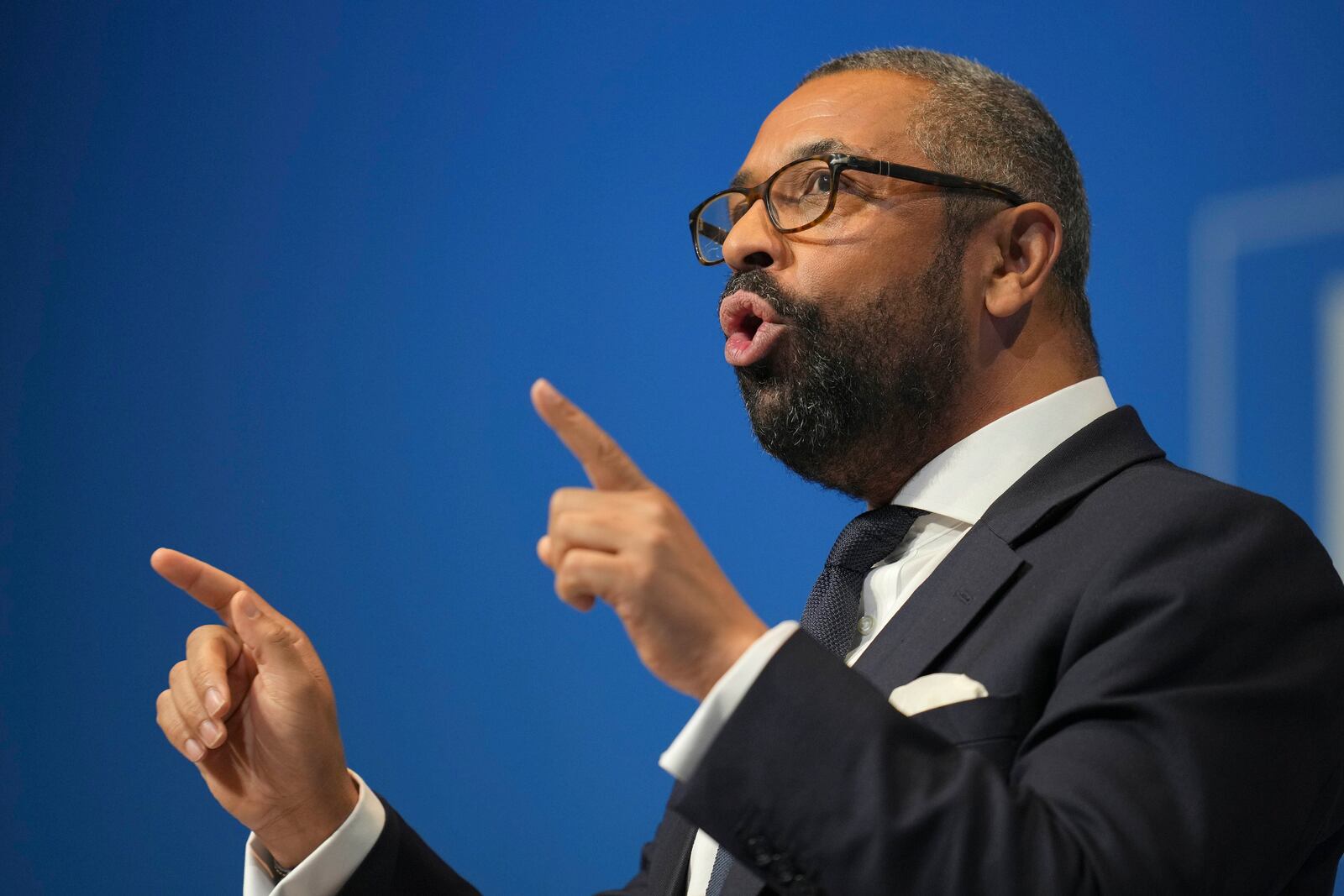 Conservative leadership candidate James Cleverly addresses members during the Conservative Party Conference at the International Convention Centre in Birmingham, England, Wednesday, Oct. 2, 2024.(AP Photo/Kin Cheung)