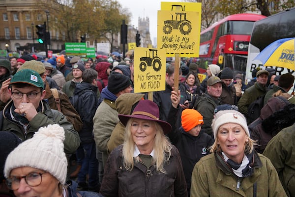 Farmers protest to urge the government to change course over its inheritance tax plans, in London, Tuesday, Nov. 19, 2024. (AP Photo/Kin Cheung)