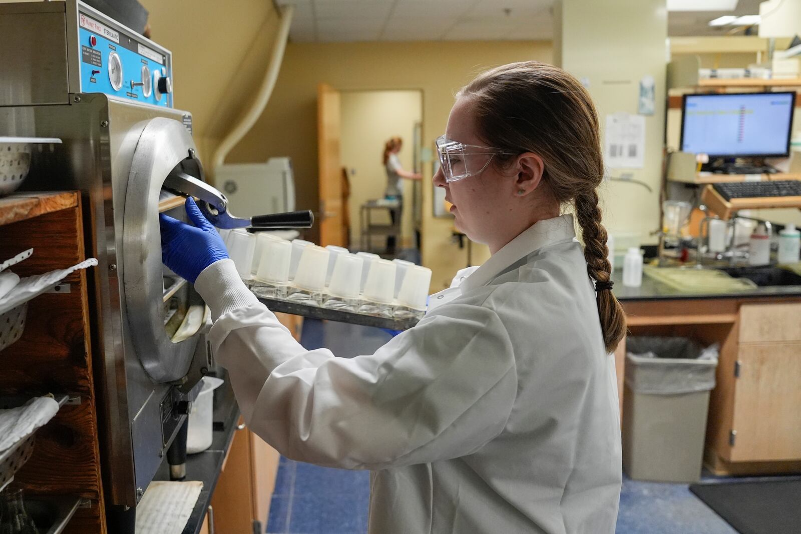 Deandra Jones prepares water samples, Monday, Aug. 26, 2024, at the National Center for Water Quality Research in Tiffin, Ohio. (AP Photo/Joshua A. Bickel)