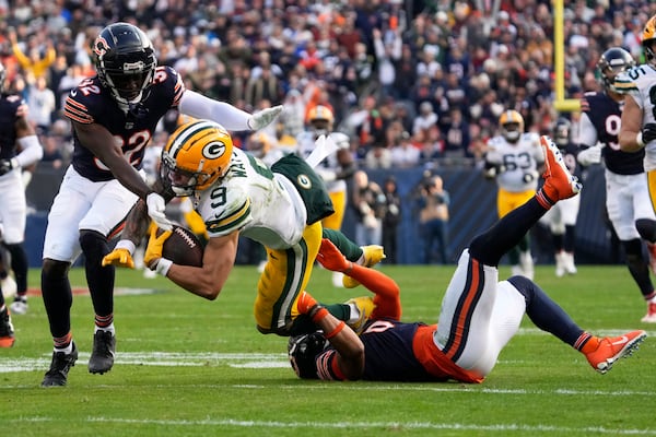 Chicago Bears' Kyler Gordon tackles Green Bay Packers' Christian Watson after a catch during the second half of an NFL football game Sunday, Nov. 17, 2024, in Chicago. (AP Photo/Nam Y. Huh)