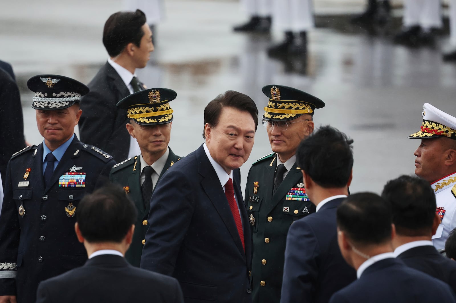 South Korean President Yoon Suk Yeol, center, arrives for a celebration to mark the 76th anniversary of Korea Armed Forces Day in Seongnam, South Korea Tuesday, Oct. 1, 2024. (Kim Hong-Ji/Pool Photo via AP)